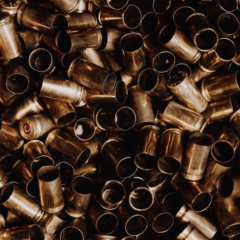 empty-ammunition-on-a-pile-2210x1473
